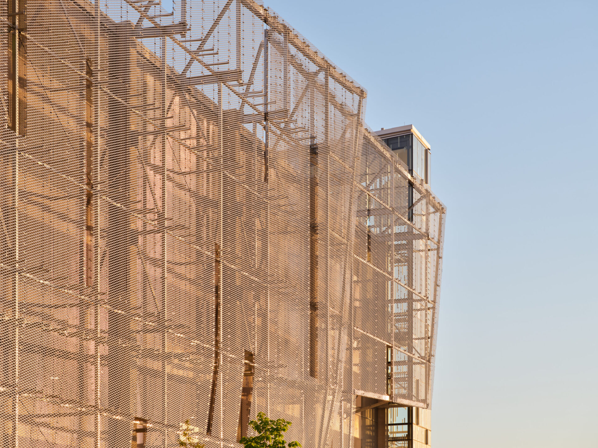 A metal-fenced building showcasing engineering and architecture.