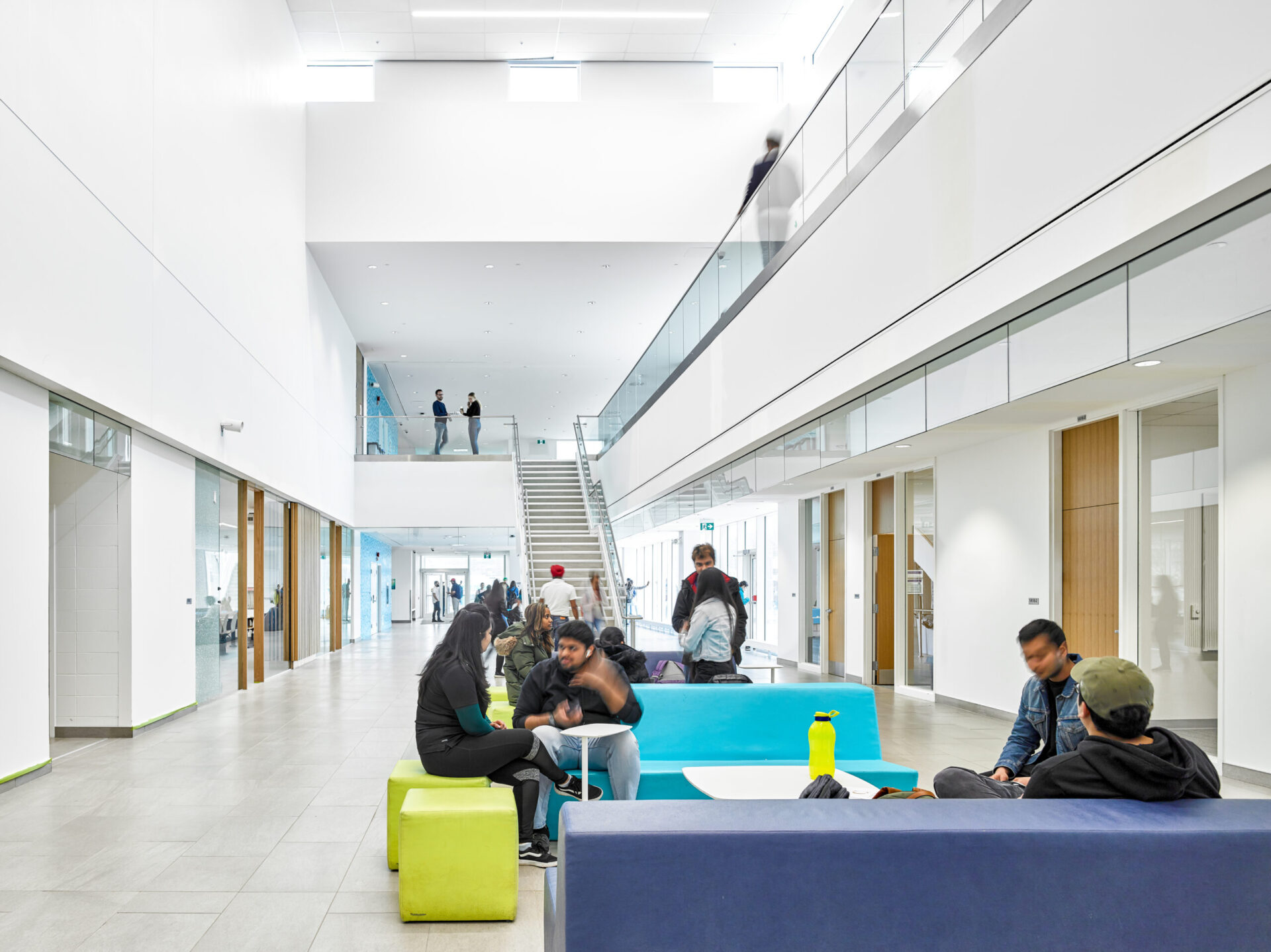 A group of people sitting in a building.