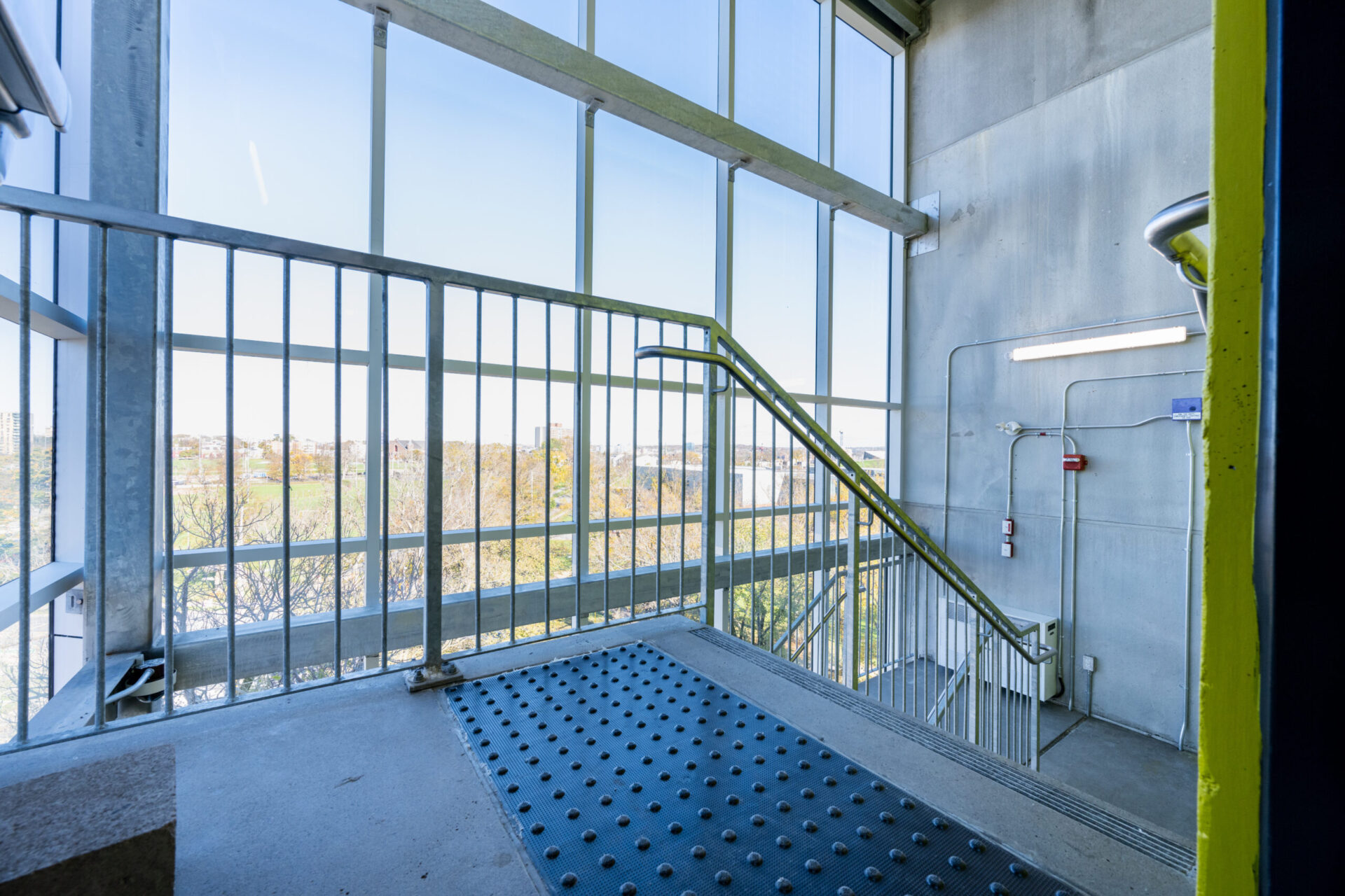 A metal railing in a staircase emphasizing architecture.

