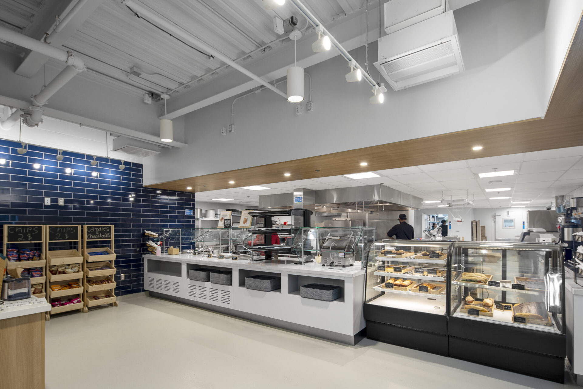 The interior of a bakery building with blue tiled walls.