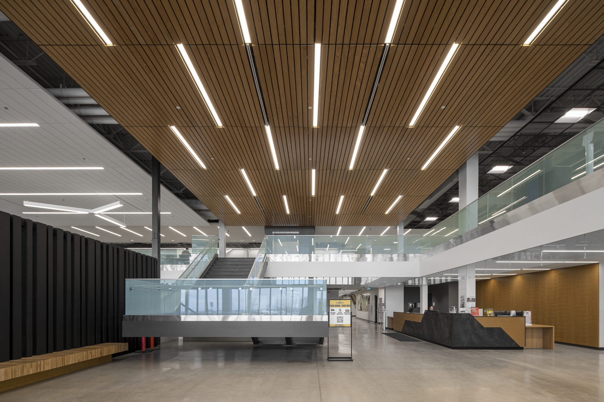 The architecture of a modern office building with wooden ceilings.