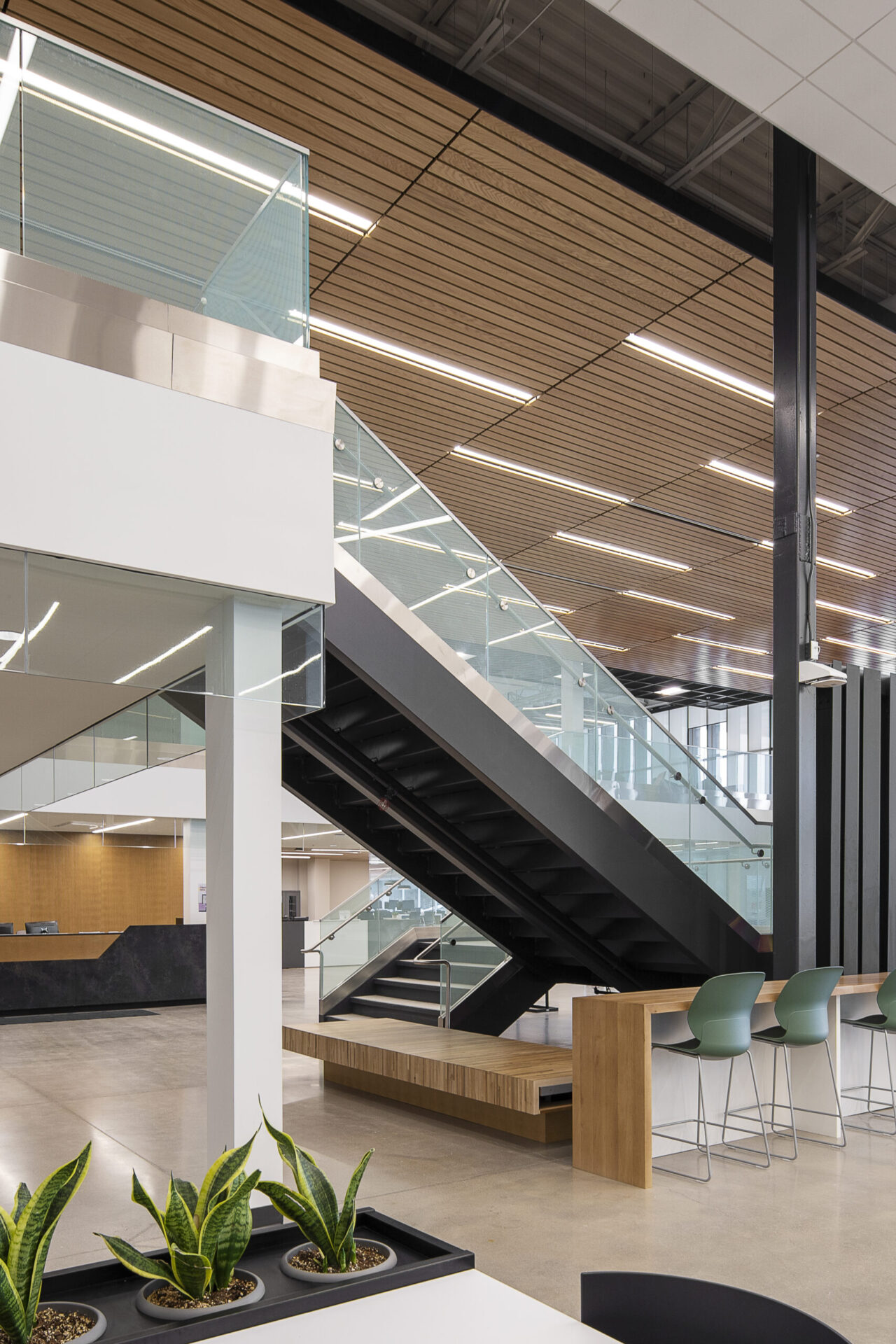 A modern office building with a staircase and planters.