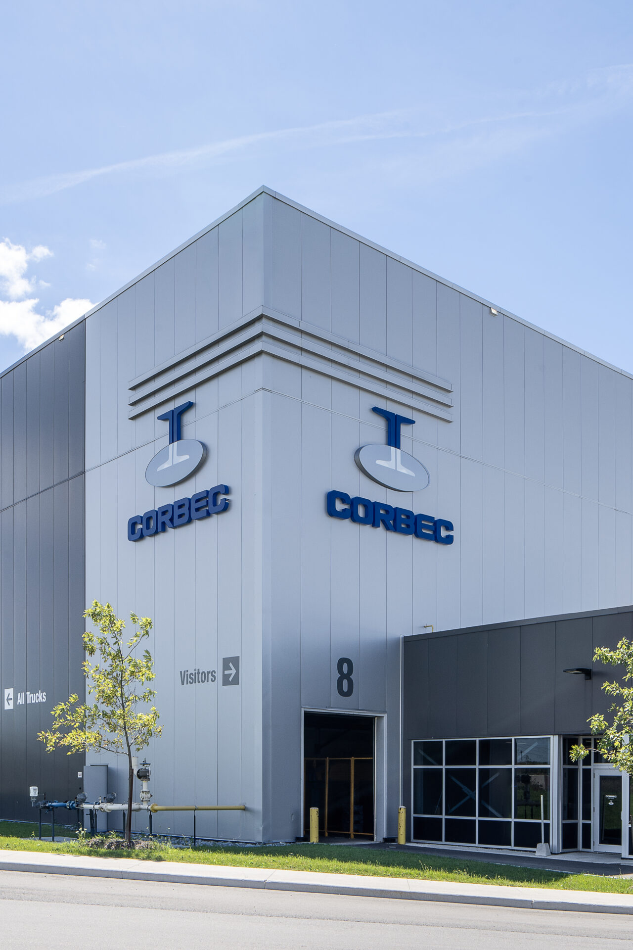 A large building with a sign that says cortec, located at a Steel Galvanizing Plant.