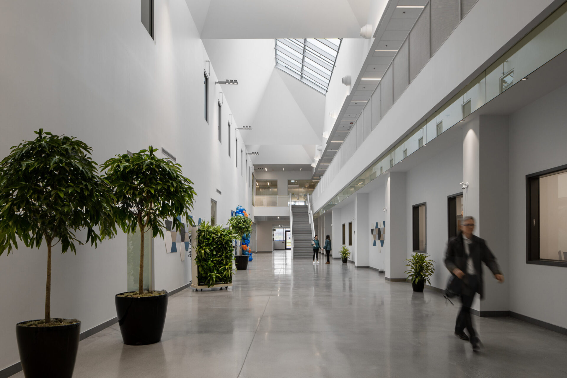 A person navigating the architecture of an office building.