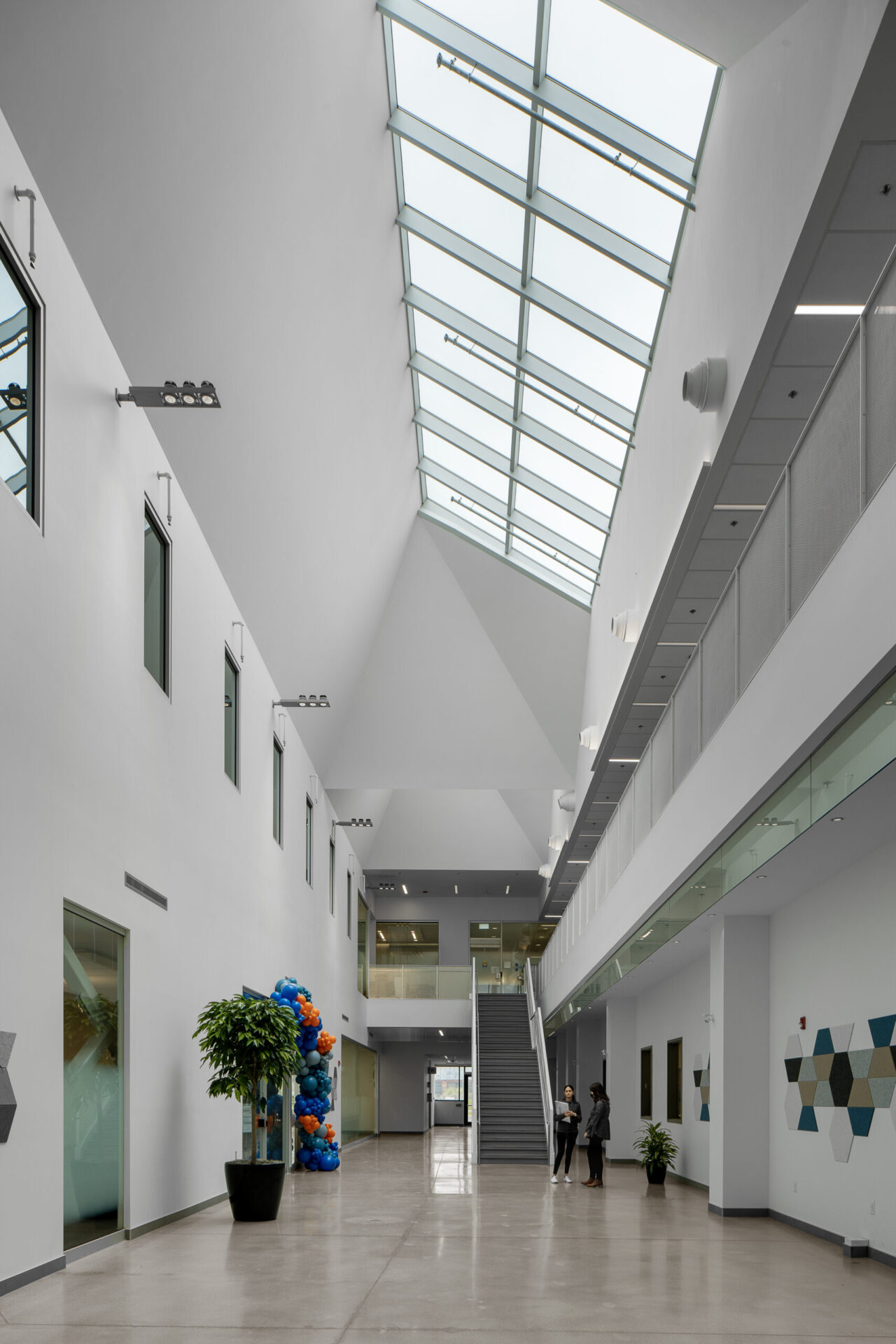 The architecture of an office building lobby with a skylight.