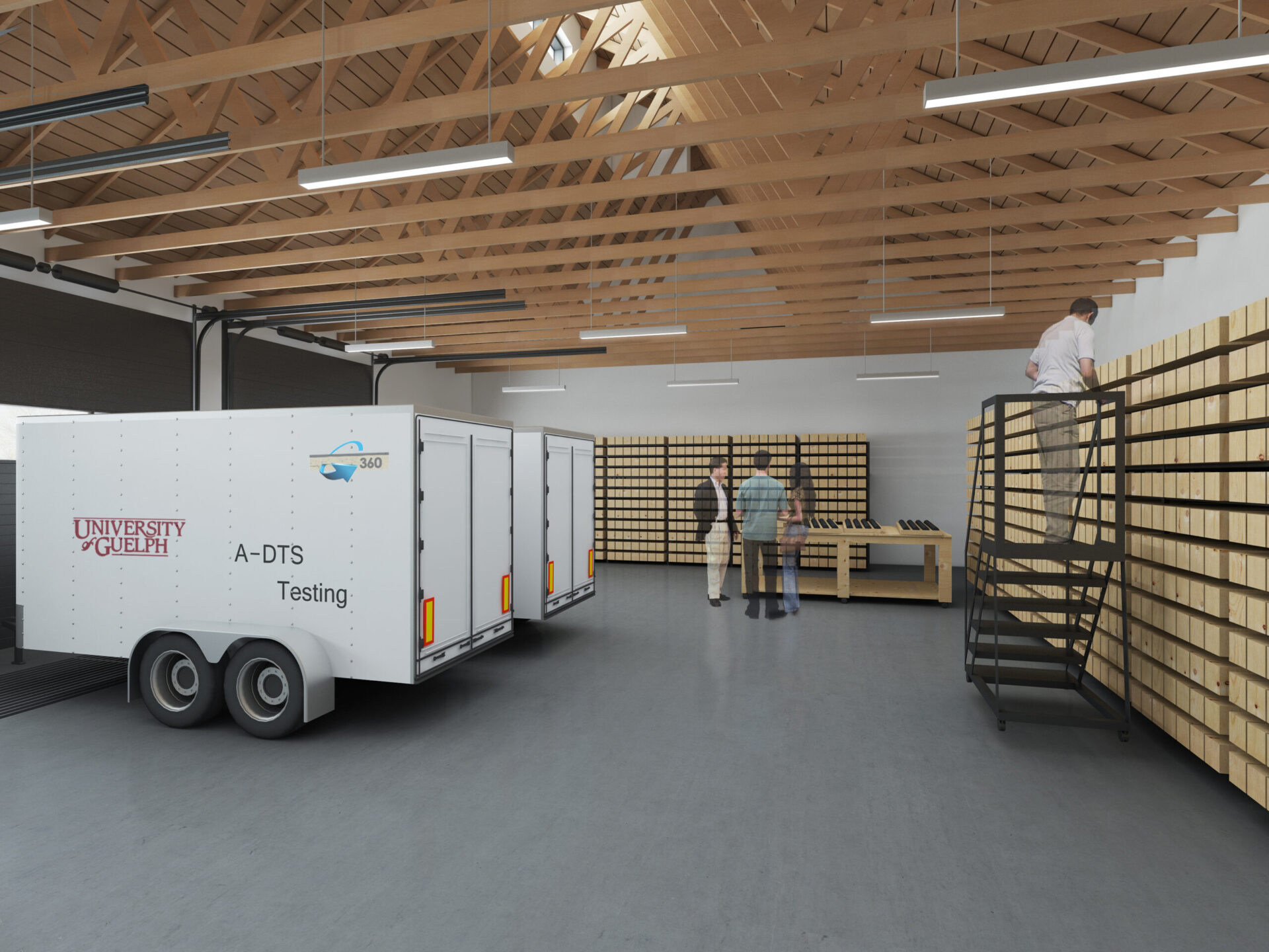 A man is standing in an architectural warehouse with a trailer.