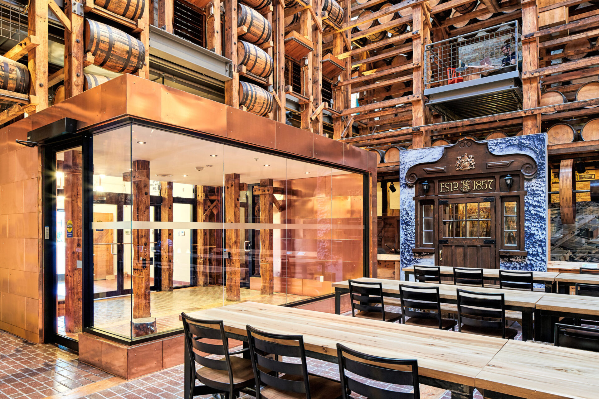 A large room with wooden tables and chairs designed for engineering and architecture purposes.