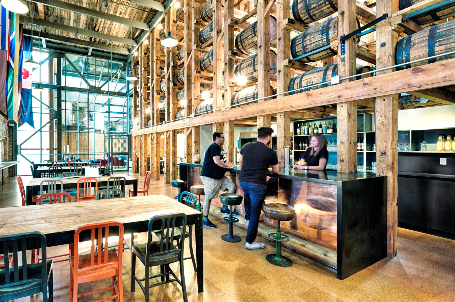 A group of people enjoying drinks at a brewery.