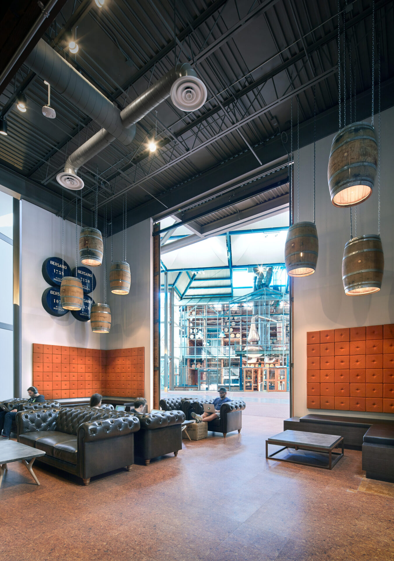 A spacious room with couches and chairs ideal for engineering studies or architectural discussions.