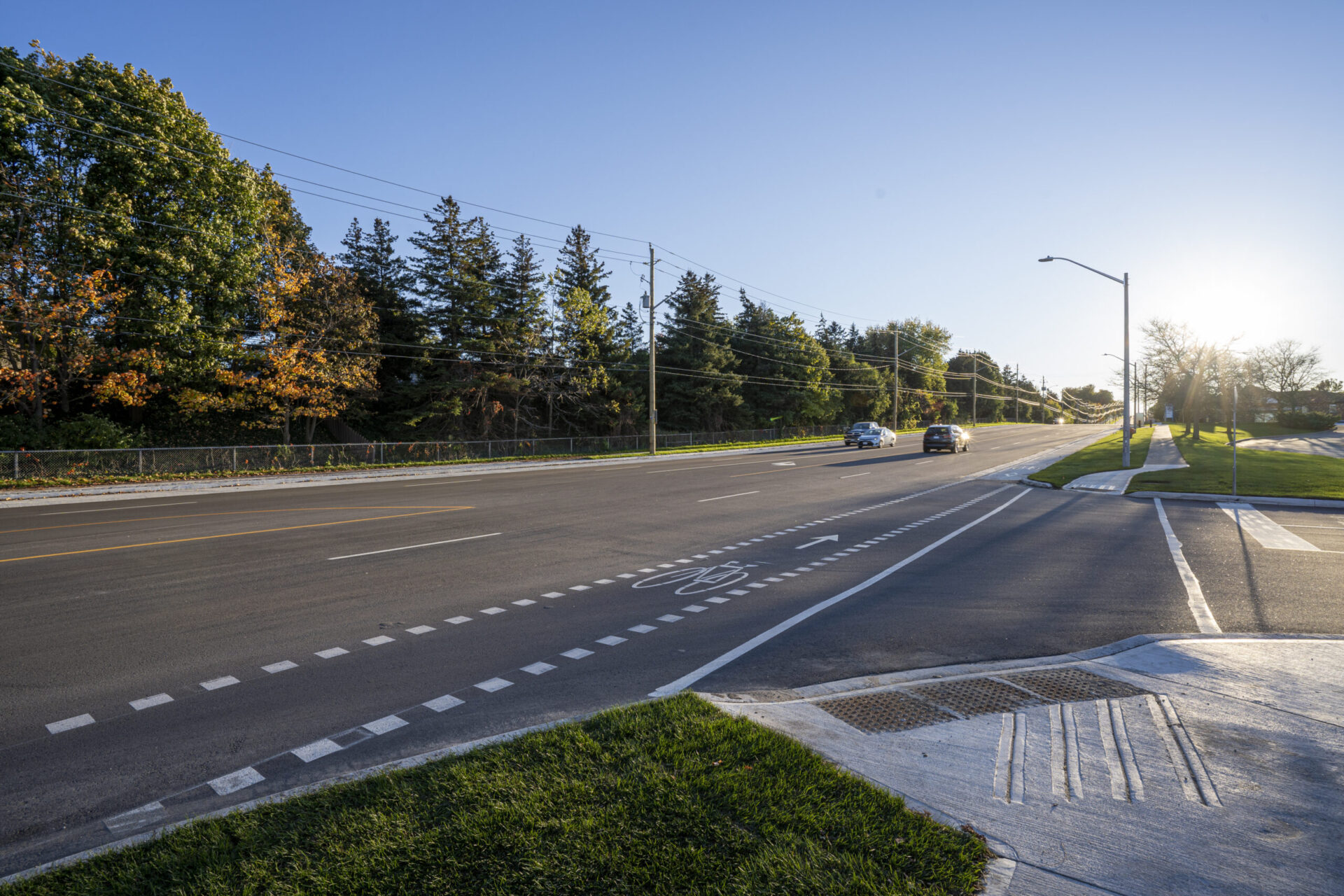 A street with cars driving down it showcases the intersection of engineering and architecture.