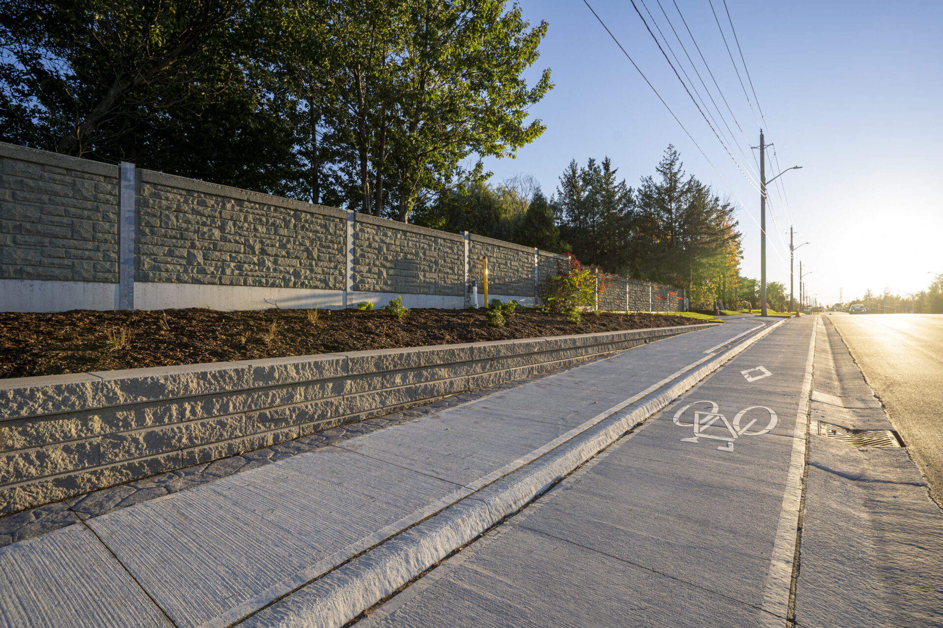 An architecturally designed sidewalk with an engineered bike lane.