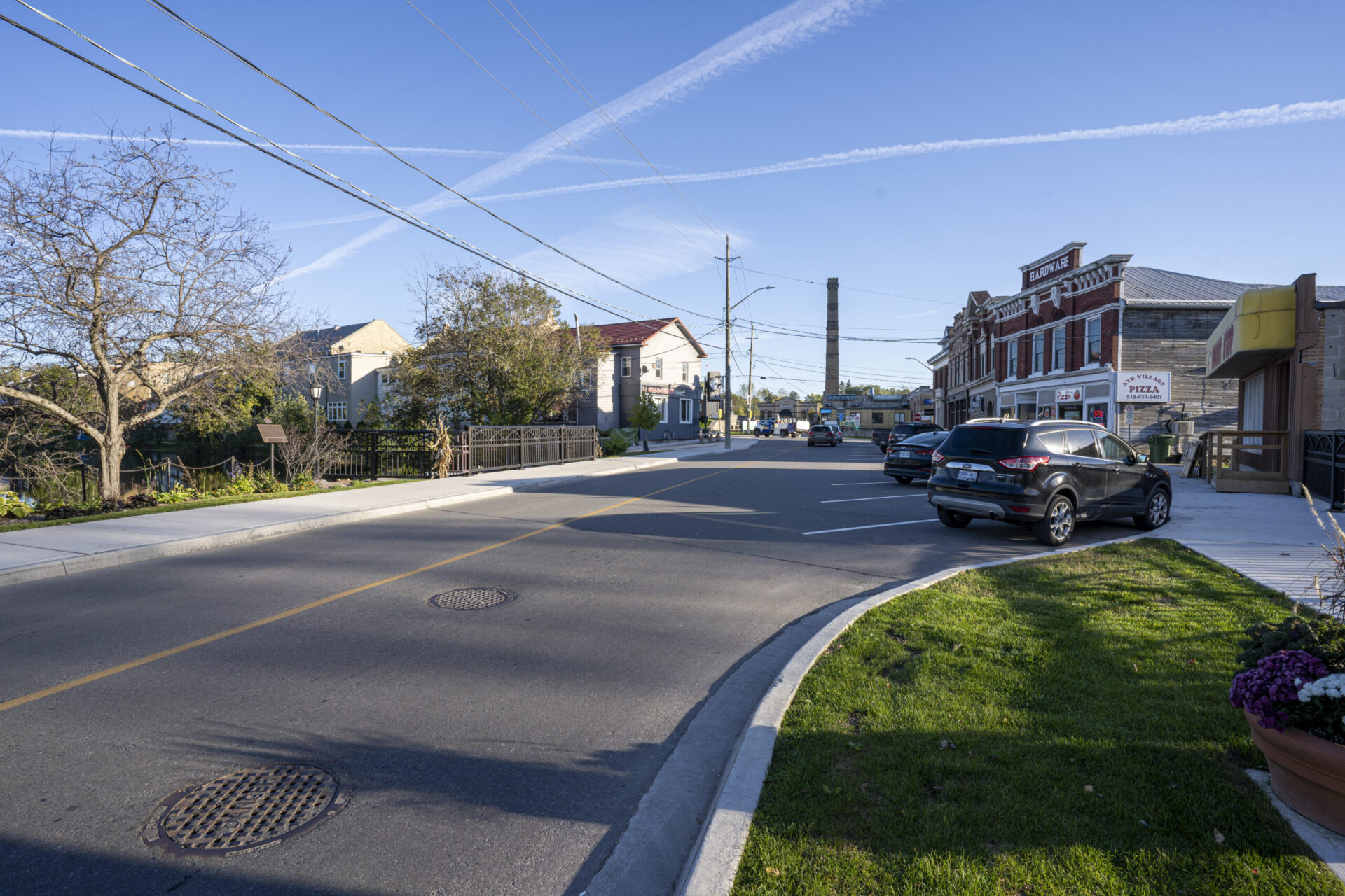 An engineered street with parked cars.