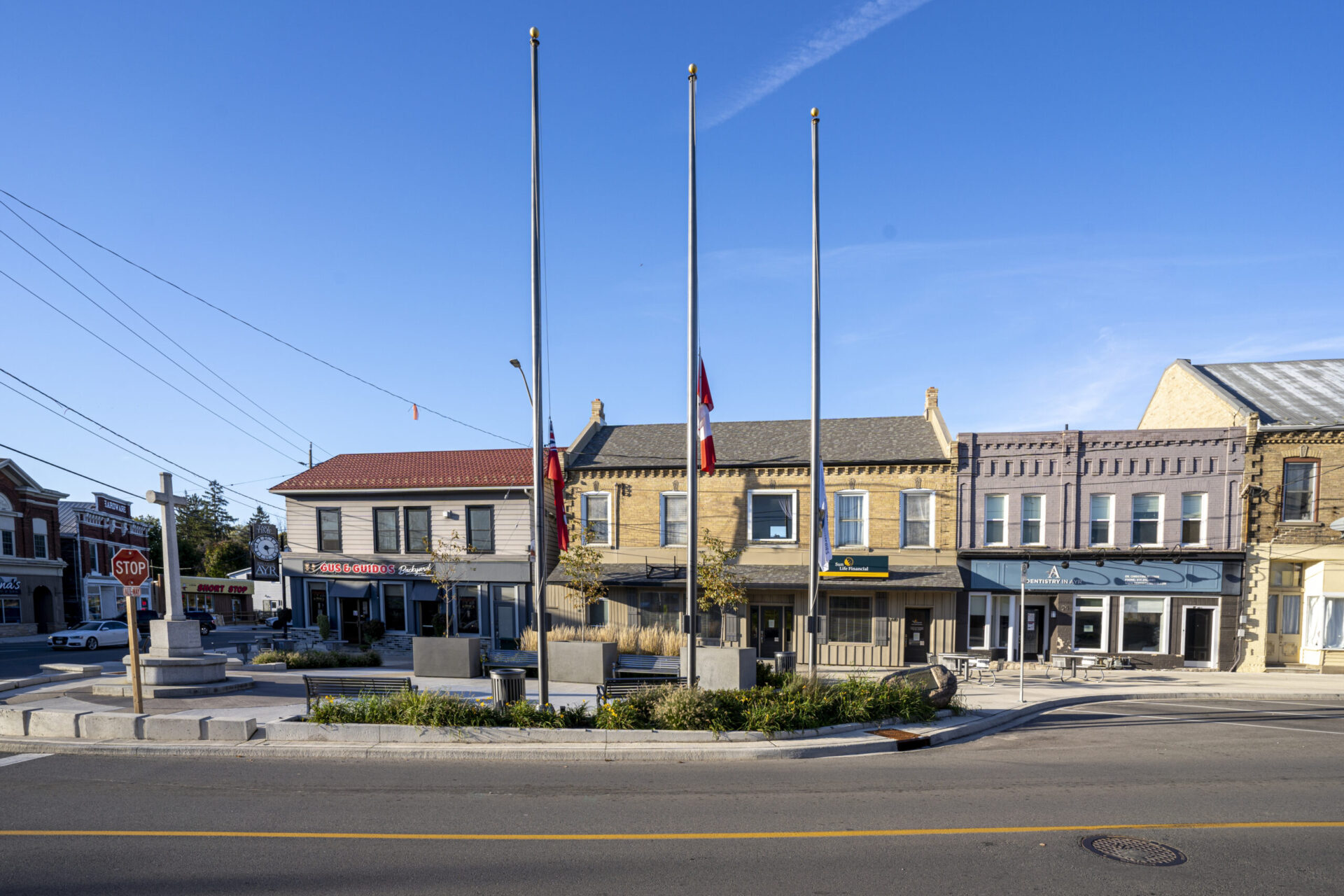 An architecturally-designed street showcasing impressive buildings and fluttering flags.