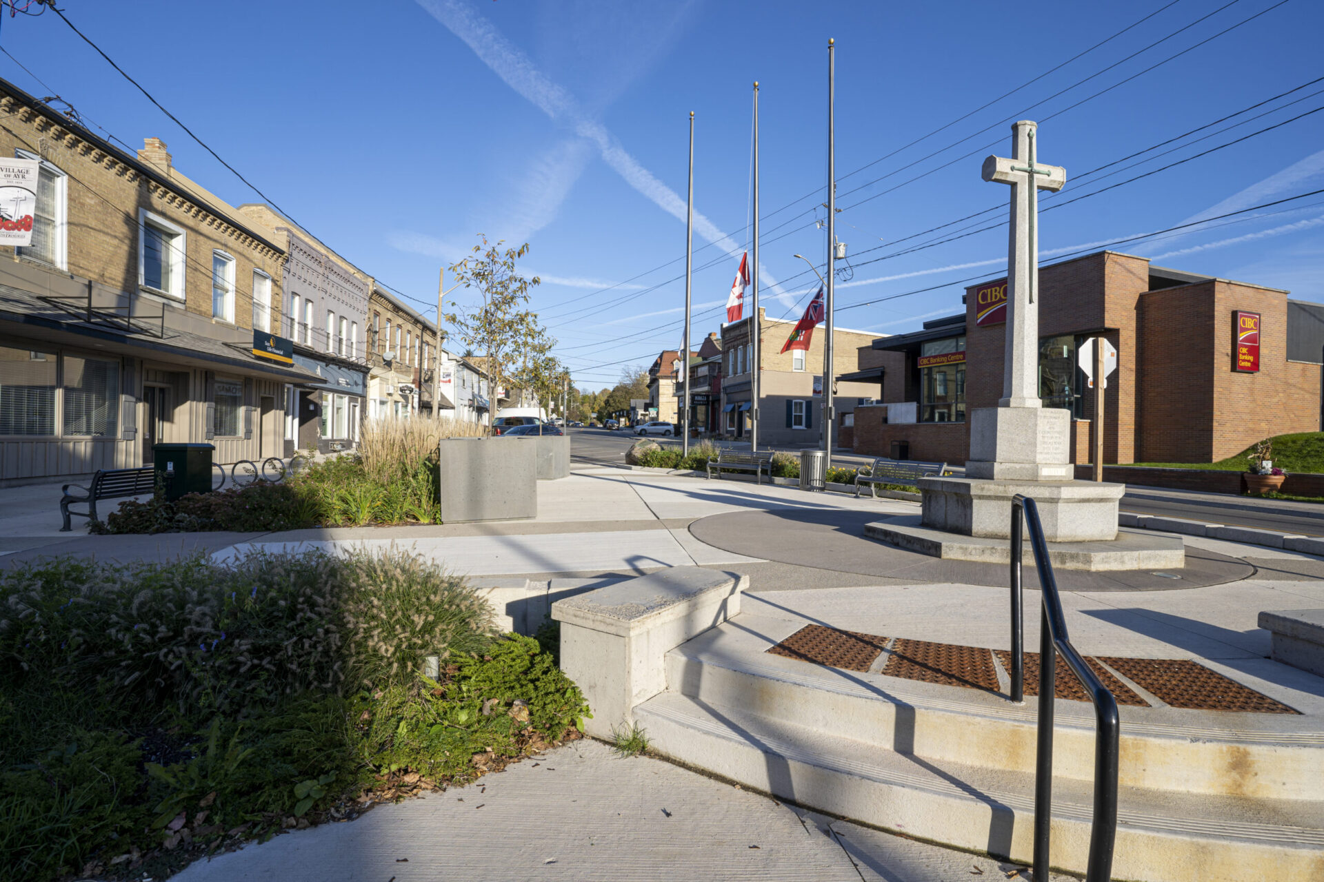 A cross in the middle of a town square illustrating architectural design.