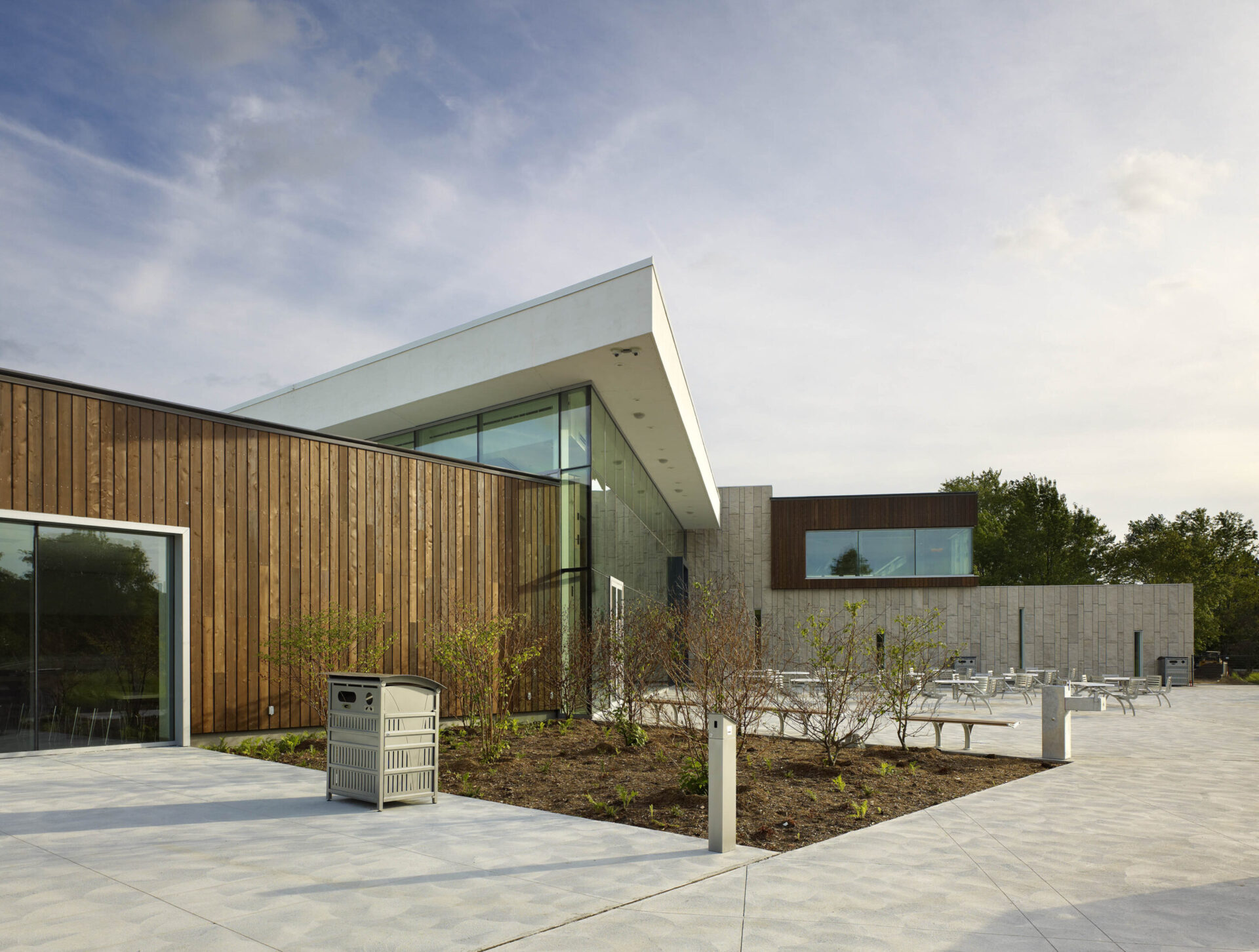 The architectural design of a building showcases a large glass wall as its exterior.