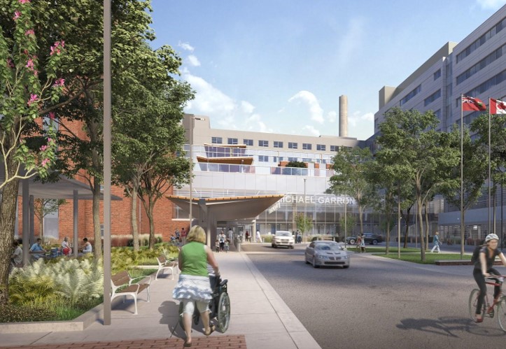 woman pushing wheelchair in front of Michael Garron Hospital